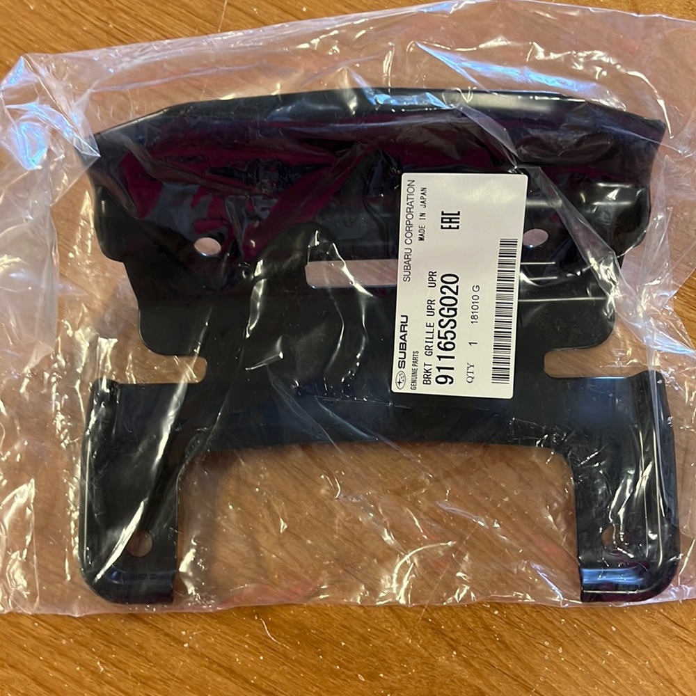 Subaru Upper Grille Bracket New In Package